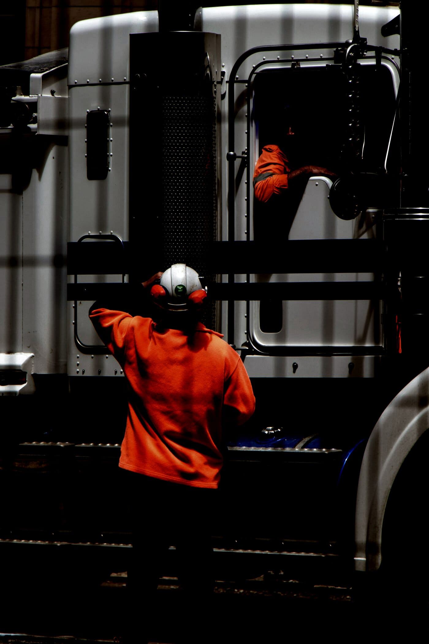 An owner-operator climbing into his cab at the yard